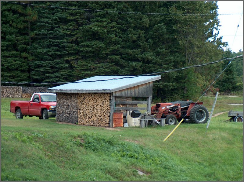 Wood Pile And Tractor.jpg