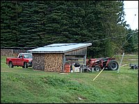 Wood Pile And Tractor.jpg